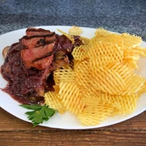 Costillitas de cerdo “Senegal” con papas rejilla