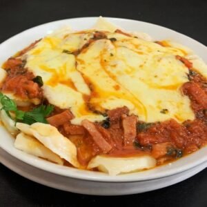 Ravioles de ricota o verdura con salsa Amatriciana (Tomate, panceta, albahaca, muzzarella)